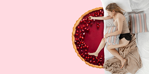 Image showing Portrait of a young girl sleeping and dreaming about cake