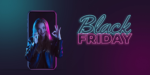 Image showing Beautiful woman inviting for shopping right from device screen, black friday, sales concept. Flyer with copyspace