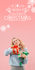 Image showing Girl hugging gifts, greeting with New Year 2021 and Christmas. Flyer with copyspace