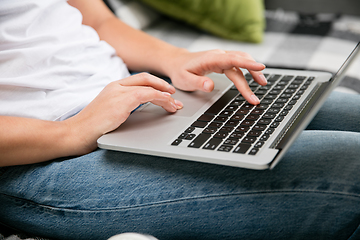 Image showing Remote working from home. Workplace in home office with PC, devices and gadgets.