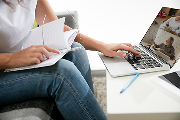 Image showing Remote working from home. Workplace in home office with PC, devices and gadgets.