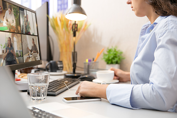 Image showing Remote working from home. Workplace in home office with PC, devices and gadgets.