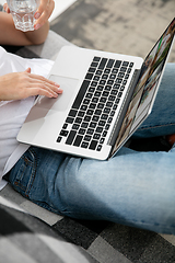 Image showing Remote working from home. Workplace in home office with PC, devices and gadgets.