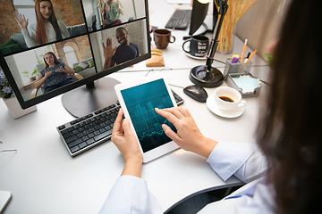 Image showing Remote working from home. Workplace in home office with PC, devices and gadgets.