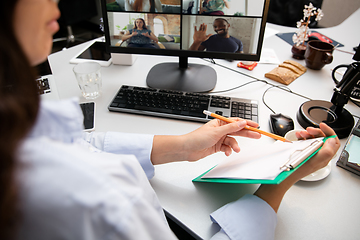 Image showing Remote working from home. Workplace in home office with PC, devices and gadgets.