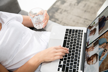 Image showing Remote working from home. Workplace in home office with PC, devices and gadgets.