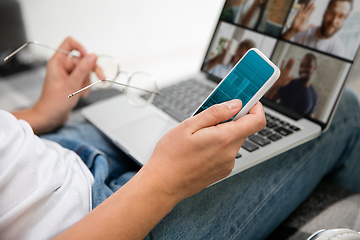 Image showing Remote working from home. Workplace in home office with PC, devices and gadgets.