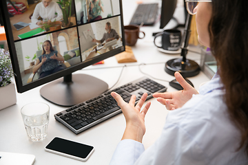 Image showing Remote working from home. Workplace in home office with PC, devices and gadgets.