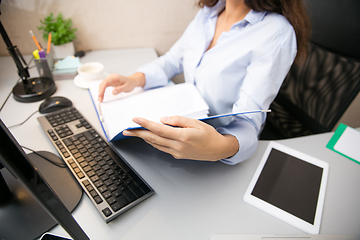 Image showing Remote working from home. Workplace in home office with PC, devices and gadgets.