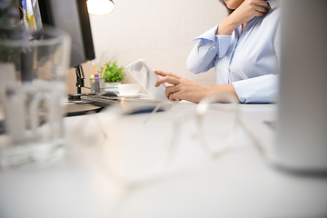 Image showing Remote working from home. Workplace in home office with PC, devices and gadgets.