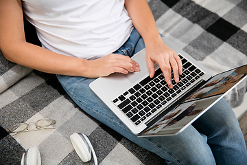 Image showing Remote working from home. Workplace in home office with PC, devices and gadgets.