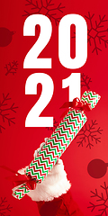 Image showing Hand of Santa Claus holding gift, greeting with New Year 2021 and Christmas. Flyer with copyspace