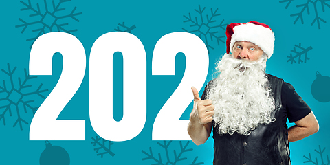 Image showing Emotional Santa Claus greeting with New Year 2021 and Christmas. Flyer with copyspace