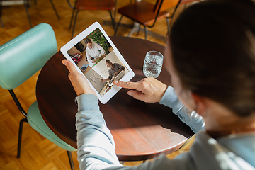 Image showing Remote working. Workplace in bar, restaurant office with PC, devices and gadgets.