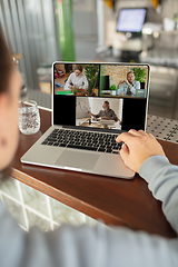 Image showing Remote working. Workplace in bar, restaurant office with PC, devices and gadgets.