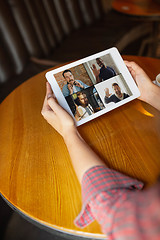 Image showing Remote working. Workplace in bar, restaurant office with PC, devices and gadgets.