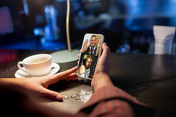 Image showing Remote working. Workplace in bar, restaurant office with PC, devices and gadgets.