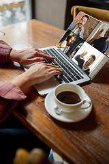 Image showing Remote working. Workplace in bar, restaurant office with PC, devices and gadgets.