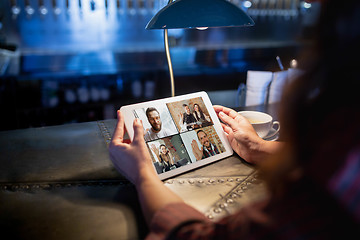 Image showing Remote working. Workplace in bar, restaurant office with PC, devices and gadgets.