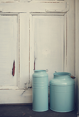 Image showing Vintage milk canisters.