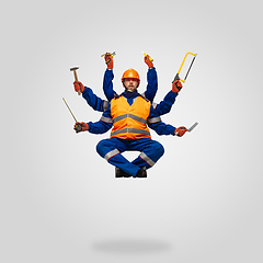 Image showing Handsome contractor, multi-armed builder levitating isolated on grey studio background