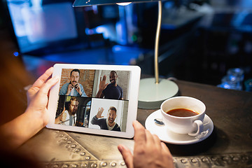 Image showing Remote working. Workplace in bar, restaurant office with PC, devices and gadgets.