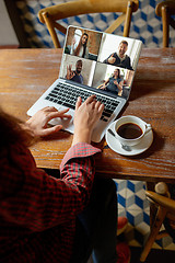 Image showing Remote working. Workplace in bar, restaurant office with PC, devices and gadgets.