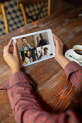 Image showing Remote working. Workplace in bar, restaurant office with PC, devices and gadgets.