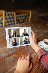 Image showing Remote working. Workplace in bar, restaurant office with PC, devices and gadgets.