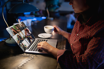 Image showing Remote working. Workplace in bar, restaurant office with PC, devices and gadgets.