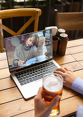 Image showing Remote working, online entertainment during quarantine. Remote events in bar, restaurant office with PC, devices and gadgets.