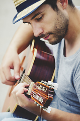 Image showing Man plays the guitar