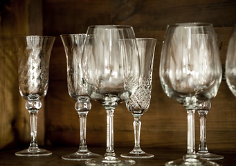 Image showing glasses on the shelf of an old cabinet