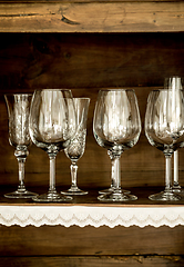 Image showing glasses on the shelf of an old cabinet