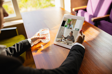 Image showing Remote working. Workplace in bar, restaurant office with PC, devices and gadgets.