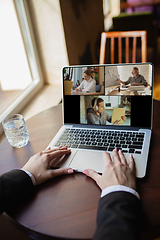 Image showing Remote working. Workplace in bar, restaurant office with PC, devices and gadgets.