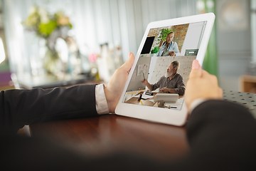 Image showing Remote working. Workplace in bar, restaurant office with PC, devices and gadgets.