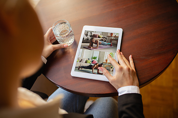 Image showing Remote working. Workplace in bar, restaurant office with PC, devices and gadgets.