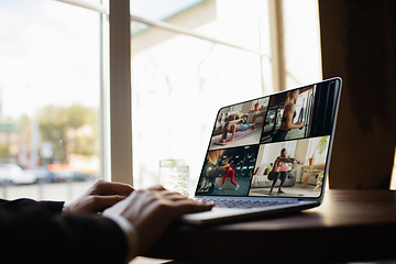 Image showing Remote working. Workplace in bar, restaurant office with PC, devices and gadgets.