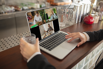 Image showing Remote working. Workplace in bar, restaurant office with PC, devices and gadgets.