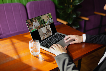 Image showing Remote working. Workplace in bar, restaurant office with PC, devices and gadgets.