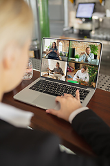 Image showing Remote working. Workplace in bar, restaurant office with PC, devices and gadgets.