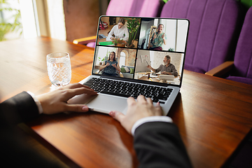 Image showing Remote working. Workplace in bar, restaurant office with PC, devices and gadgets.