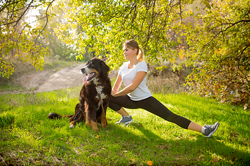 Image showing Disabled woman walking down and training outdoors in forest