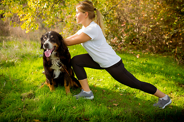 Image showing Disabled woman walking down and training outdoors in forest