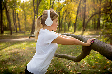 Image showing Disabled woman walking down and training outdoors in forest