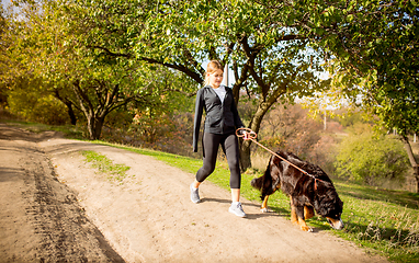 Image showing Disabled woman walking down and training outdoors in forest