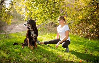 Image showing Disabled woman walking down and training outdoors in forest