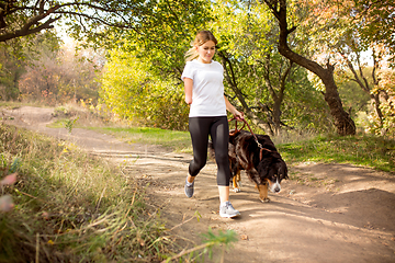 Image showing Disabled woman walking down and training outdoors in forest