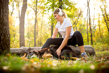 Image showing Disabled woman walking down and training outdoors in forest